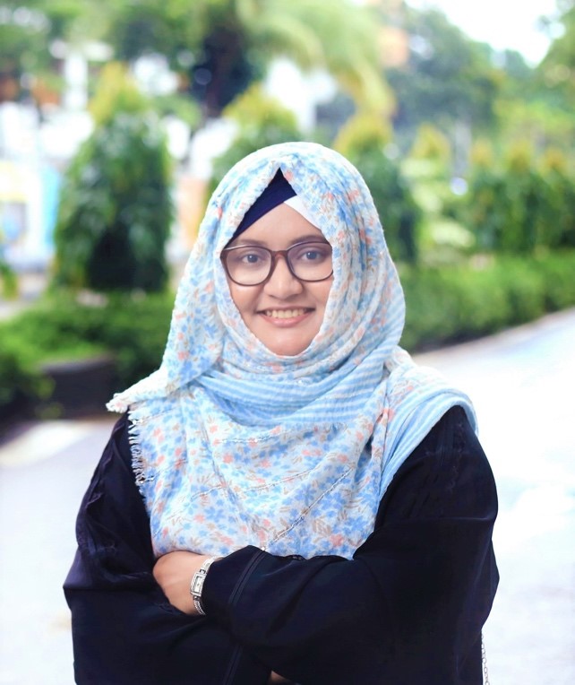 A person wearing glasses and a head scarf

AI-generated content may be incorrect.