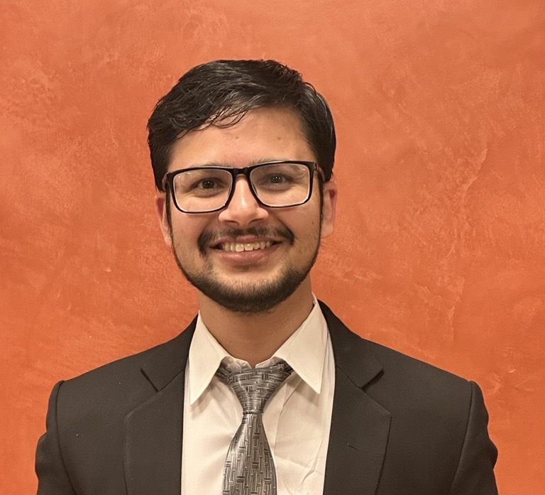 A person in a suit and tie

AI-generated content may be incorrect.