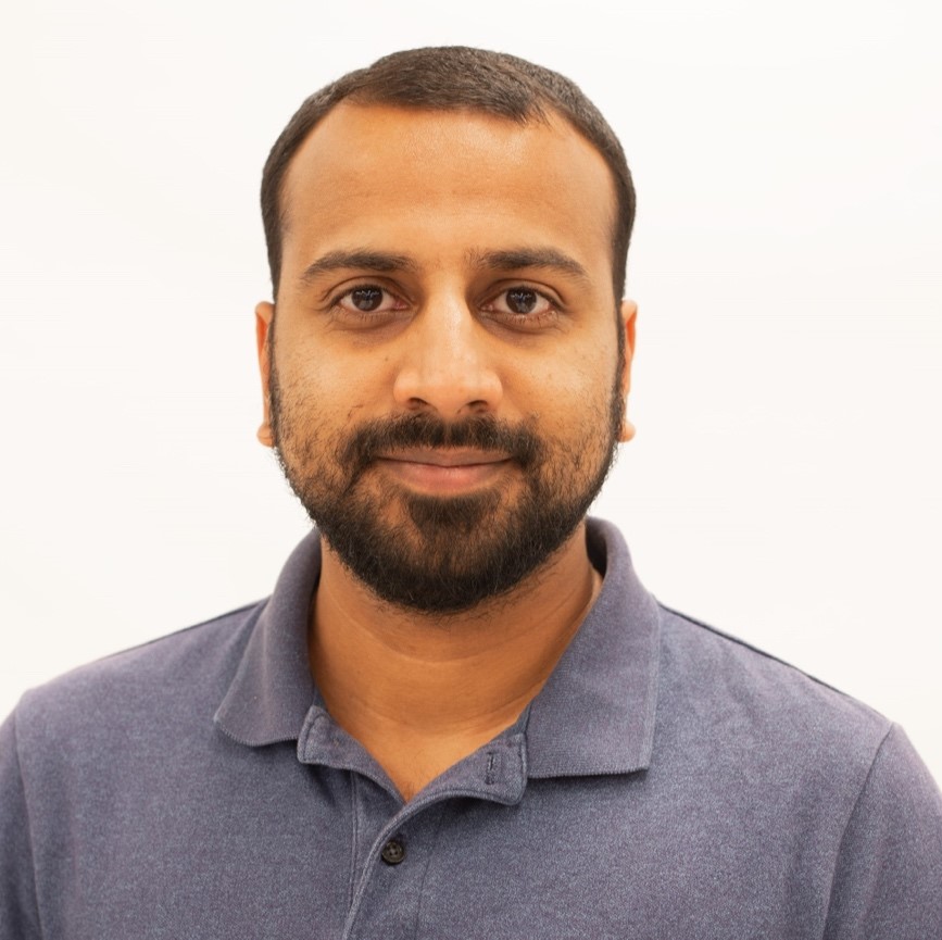 A person with a beard and mustache wearing a blue shirt

AI-generated content may be incorrect.