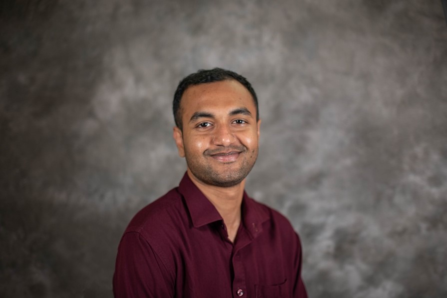A person in a maroon shirt

AI-generated content may be incorrect.