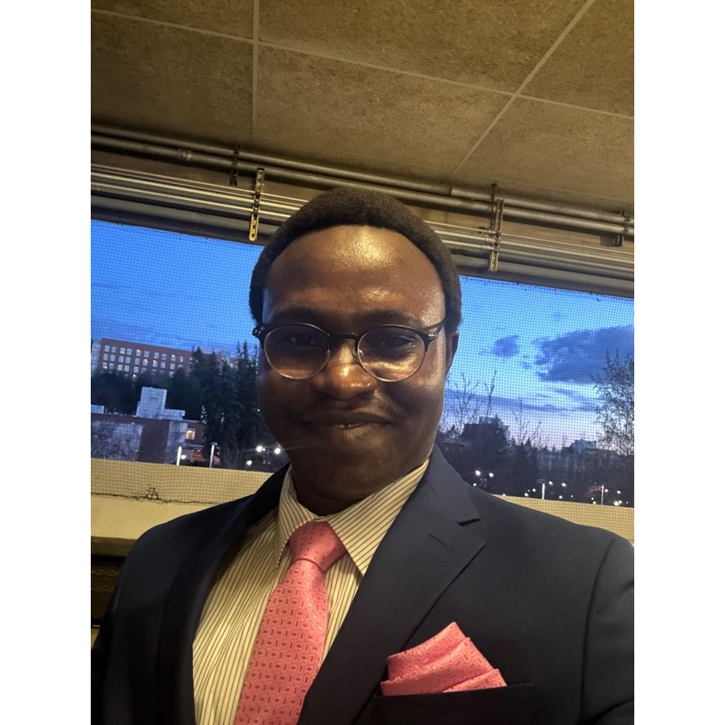 A person in a suit and tie

AI-generated content may be incorrect.