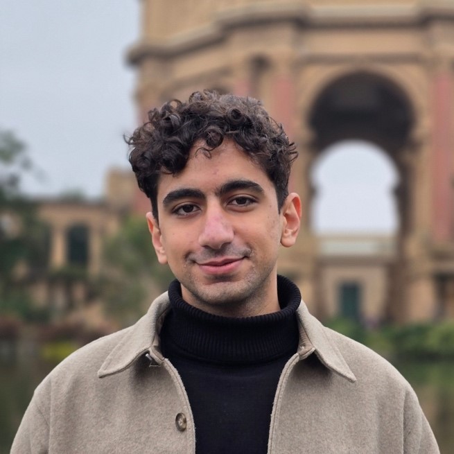 A person in a coat

AI-generated content may be incorrect.