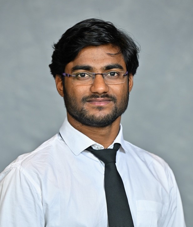 A person wearing glasses and a tie

AI-generated content may be incorrect.