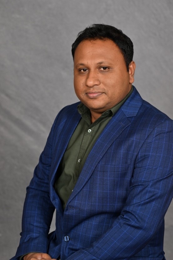 A person in a blue suit

AI-generated content may be incorrect.