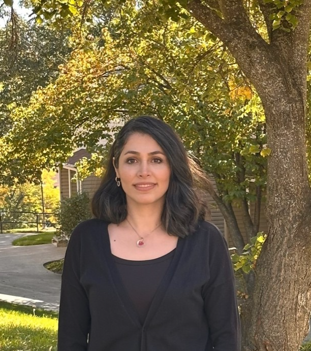 A person standing in front of a tree

AI-generated content may be incorrect.
